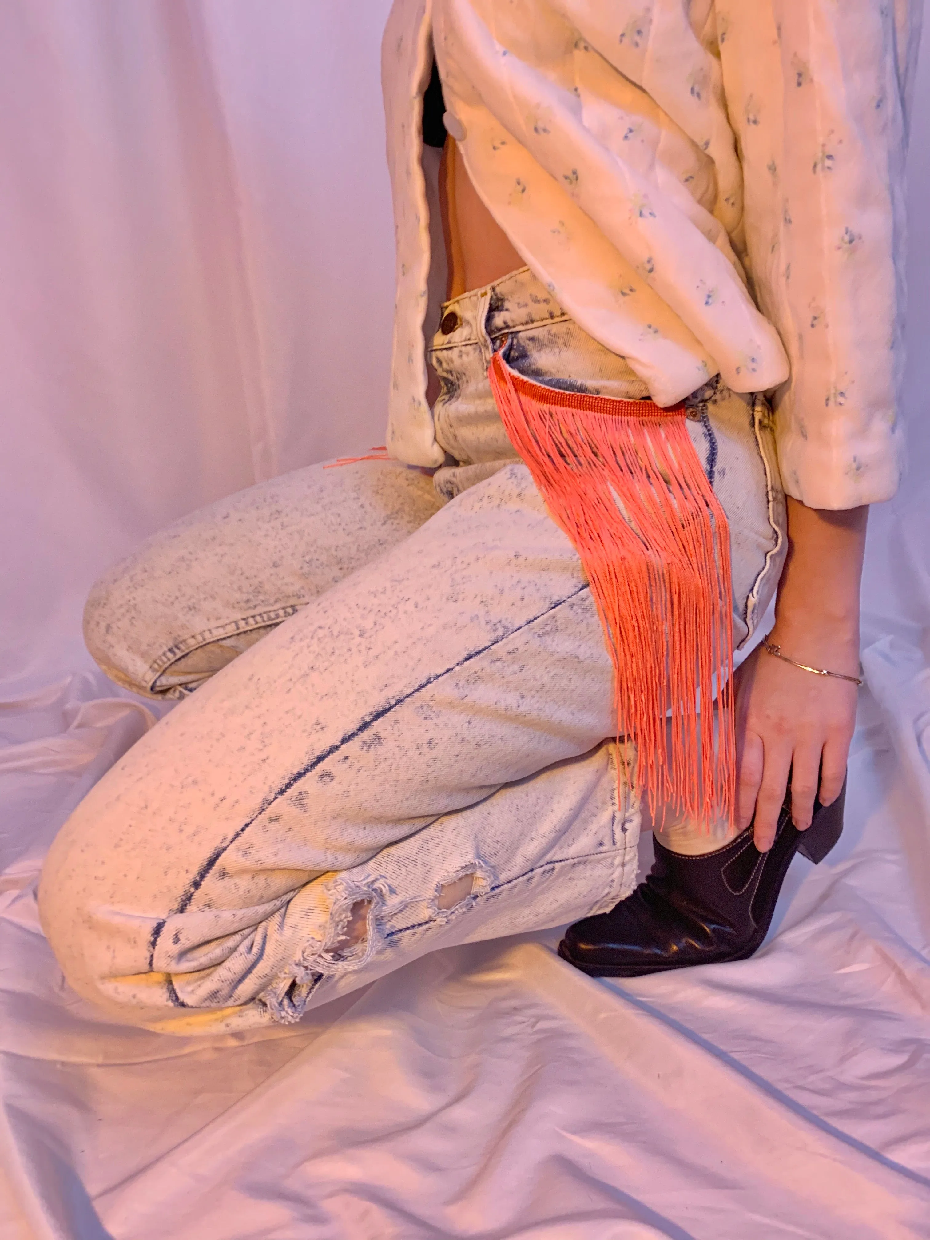 Acid wash fringe jeans